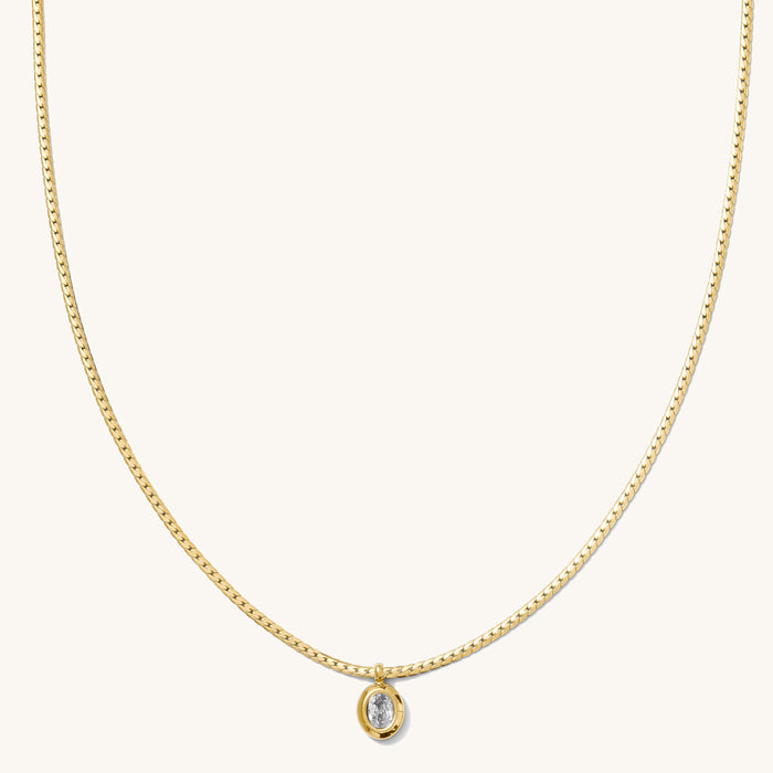 Close up of the gold Martina herringbone necklace on a white background