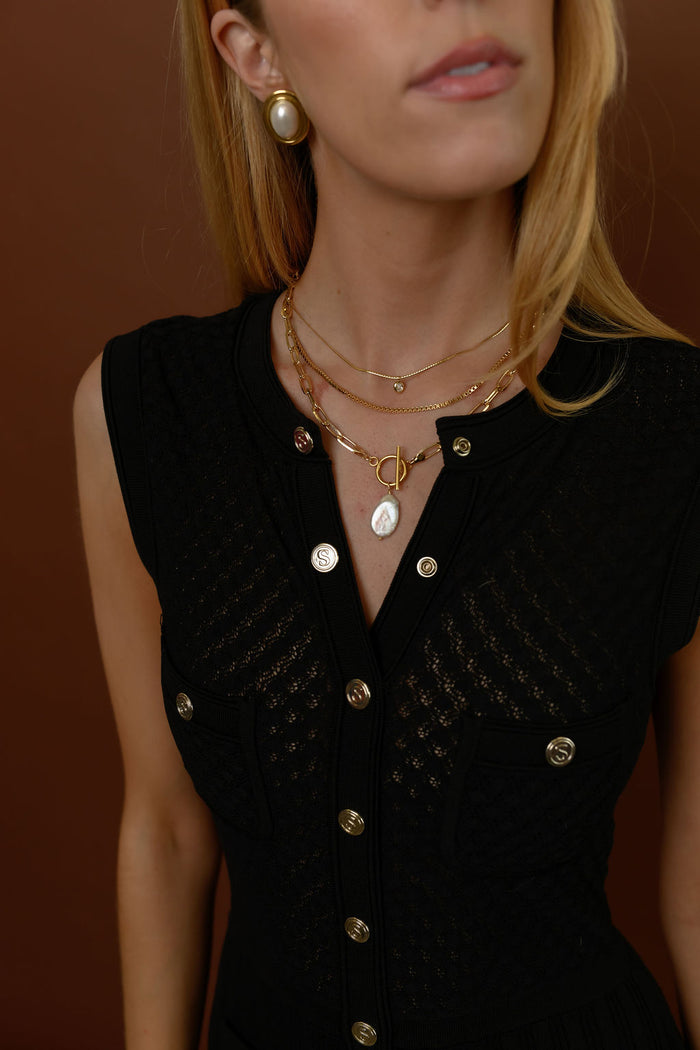 Close up of the gold Martina herringbone necklace by Beads by Tara on a white background