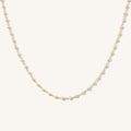 Close up of the gold Maui pearl necklace on a white background