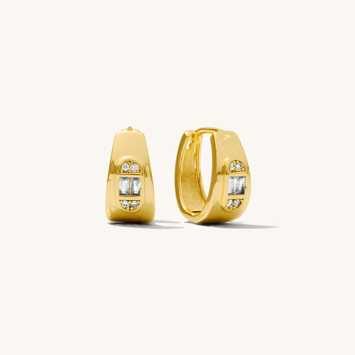 Maya earrings in gold with sleek baguette-cut stones and art-deco styling