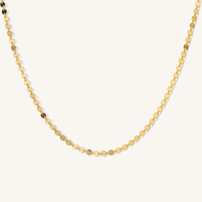 Close up of the Michelle disc choker necklace on a white background
