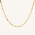 Close up of the Michelle disc choker necklace on a white background