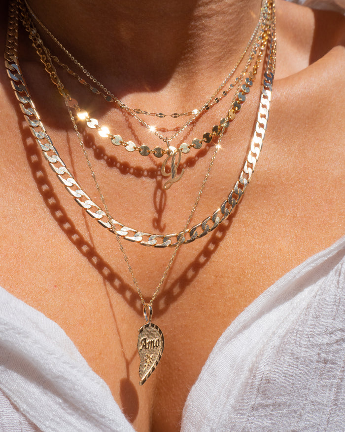 Model wearing the gold Michelle disc choker necklace from Beads by Tara