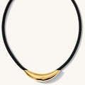 Close up of the gold Monroe bar necklace on a paracord chain on a white background