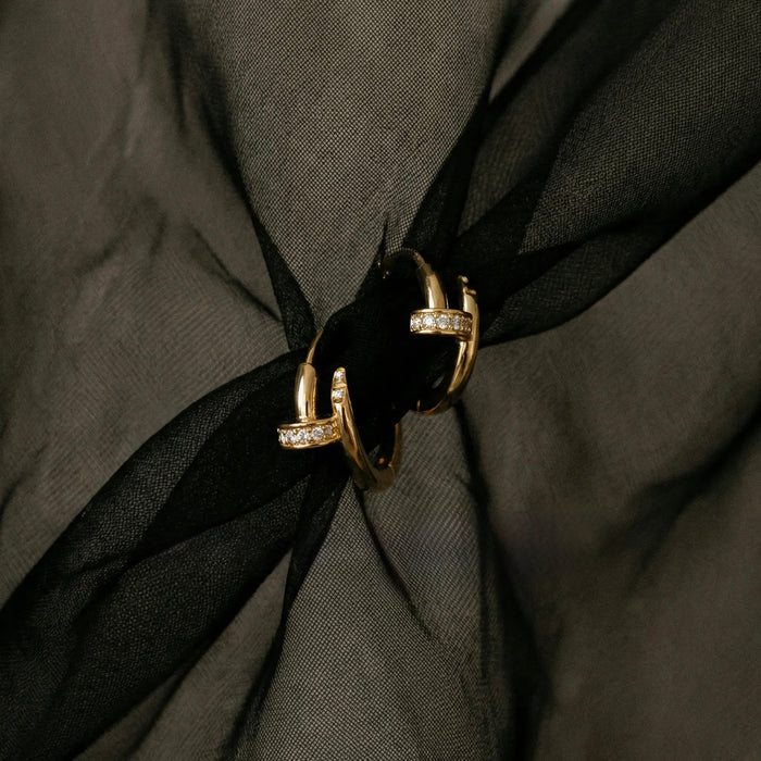 Nailed It huggies, a sculptural curved nail design in 14k gold vermeil