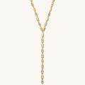 Close up of the gold Nellie lariat necklace on a white background
