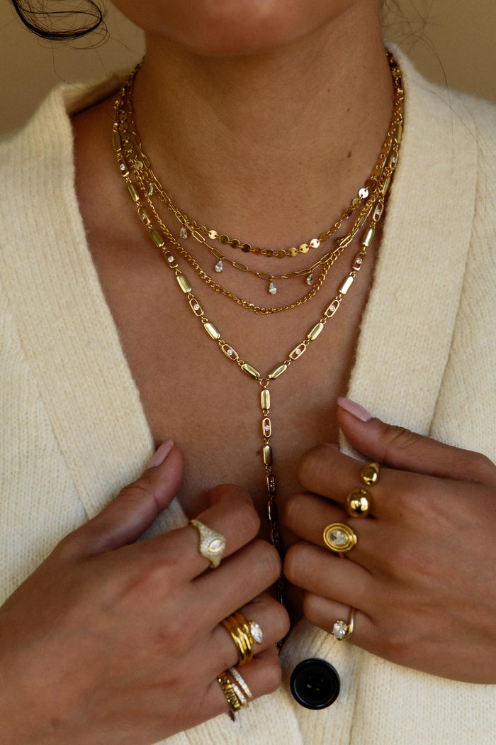 Statement gold lariat necklace with cascading cubic zirconia stones