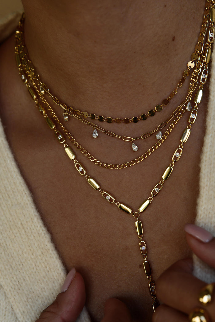 Gold plated Nellie lariat necklace with a four inch sparkling drop