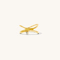 Detail view of the gold North Star ring on a white background