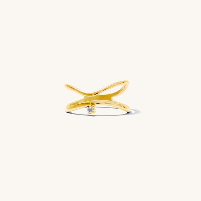 Detail view of the gold North Star ring on a white background