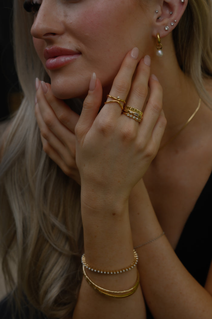 The gold North Star ring from Beads by Tara, shown on a white background