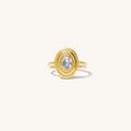 Close up of the gold Odette oval stone ring on a white background