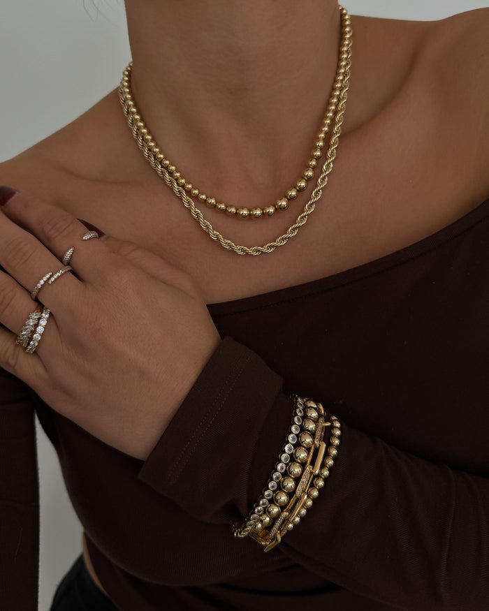 Model wearing the gold Ombre bead necklace from Beads by Tara