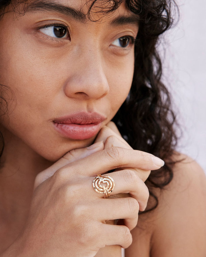 Overcome Ring in 14k gold finish on model