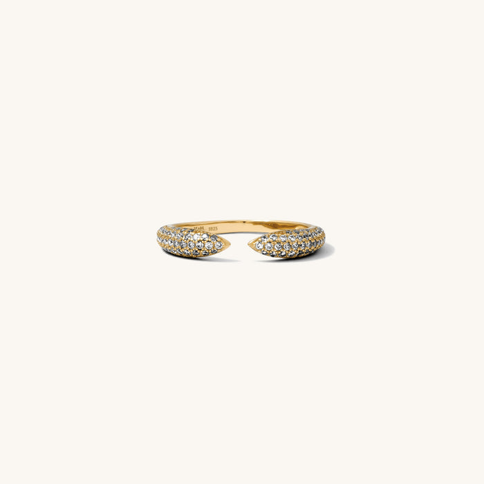 Detail view of the gold Pavé Claw ring on a white background