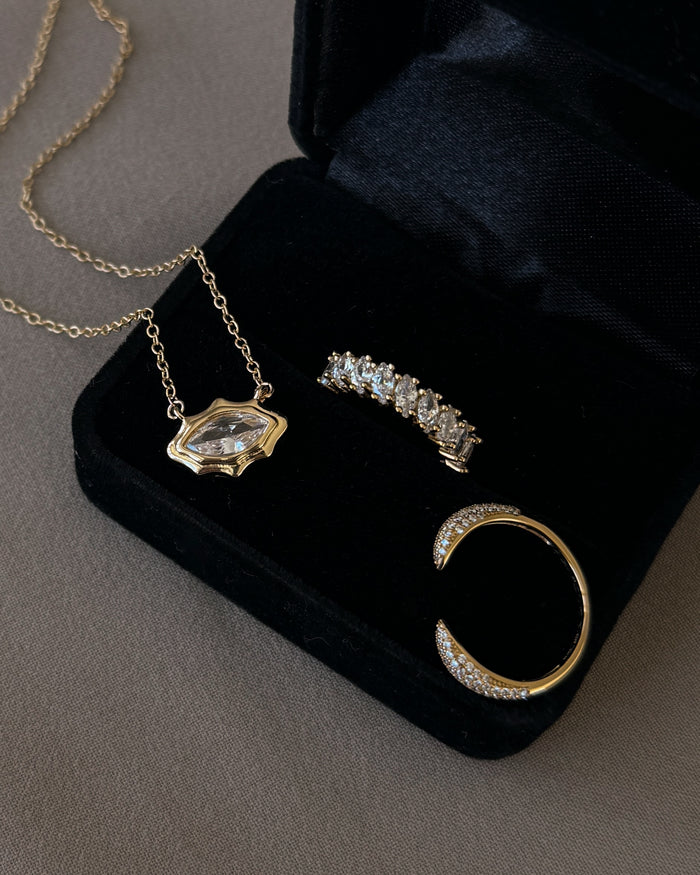 A campaign shot of a model wearing the gold Pavé Claw ring by Beads by Tara