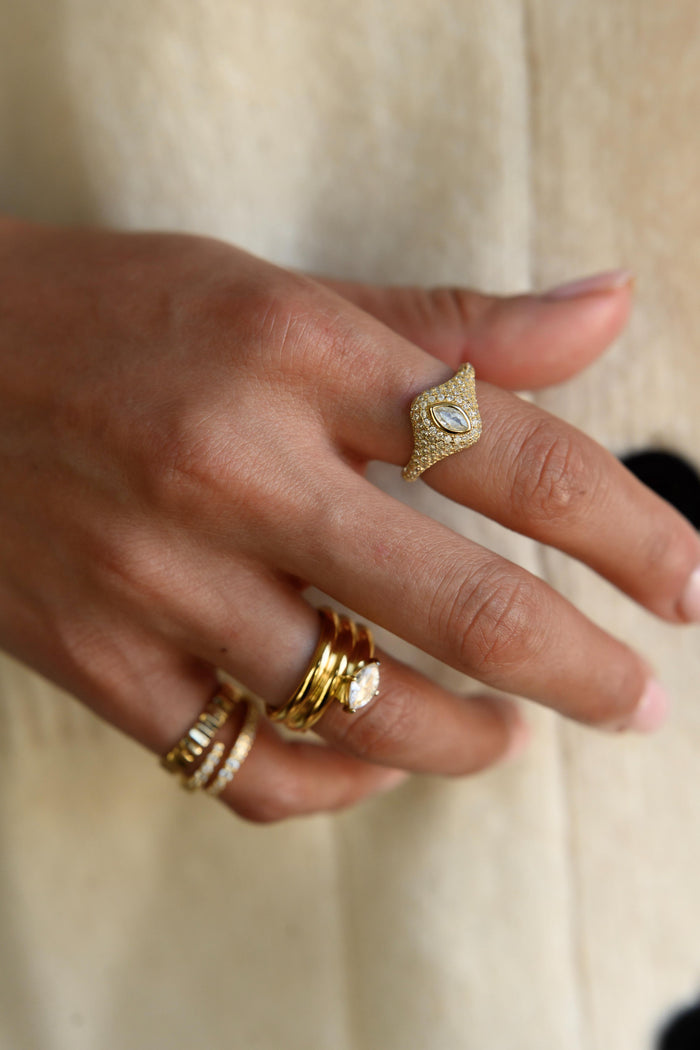 Vintage inspired gold signet ring covered in glittering pave stones