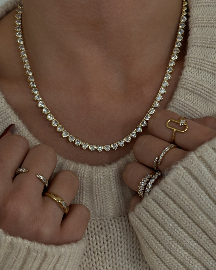 Model wearing the gold Queen of Hearts bezel tennis necklace from Beads by Tara