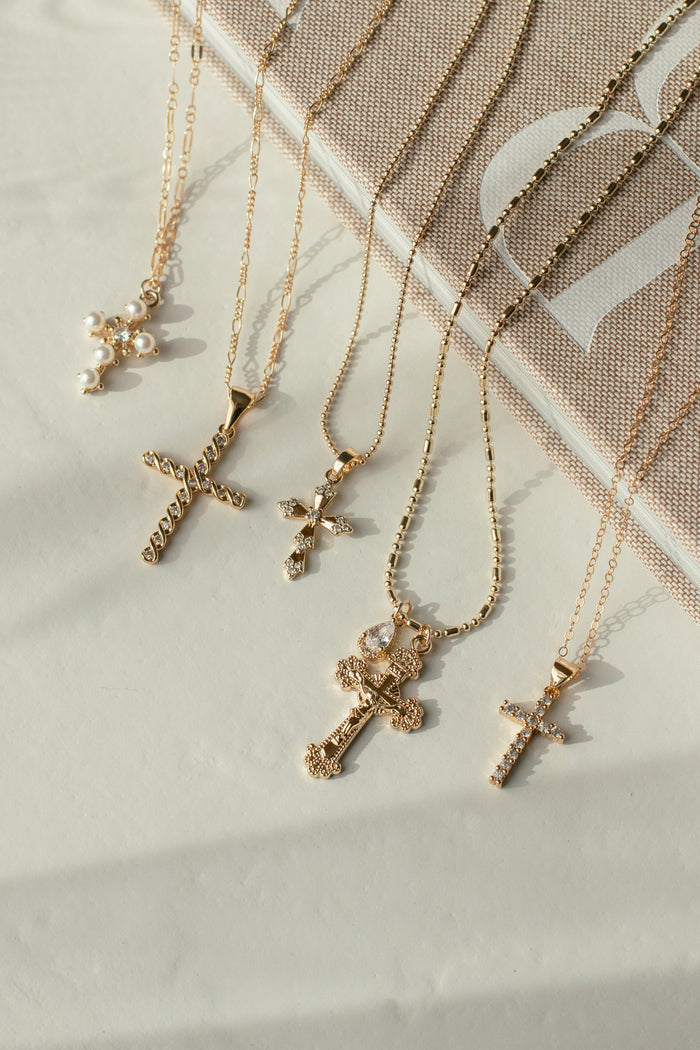 Close view of the pearls and inset center stone on the Queen's Cross pendant