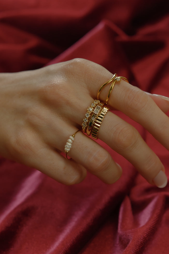 The gold Raeé fluted ring from Beads by Tara, shown on a white background