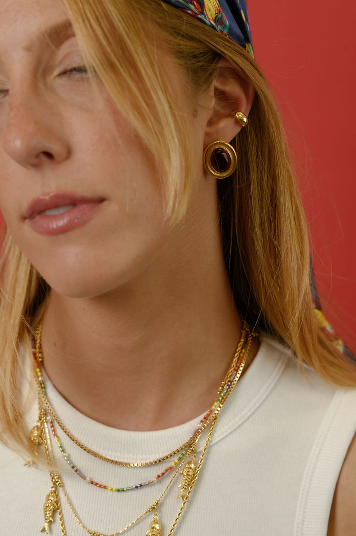The gold Rainbow Pearl necklace from Beads by Tara, shown on a white background
