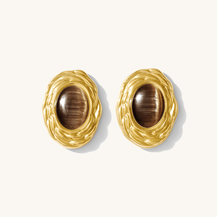 Close-up of earrings on a white background