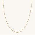Close up of the two-tone Riley bead necklace on a white background