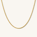 Close up of the gold Rio rope chain necklace on a white background