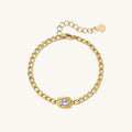 Close up of gold chain bracelet on a white background