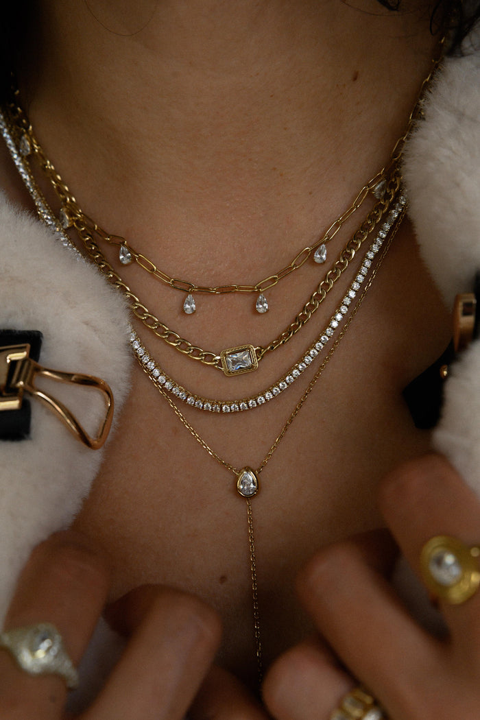 Gold Rocky chain necklace with an emerald cut white topaz centerpiece