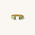 Roman ring in emerald, an open cuff band with green stones framing the opening