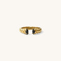Roman ring in onyx, an open cuff band with black stones framing the opening