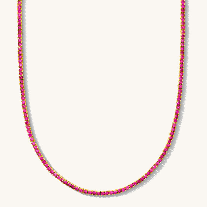 Close up of the Ruby Everyday tennis necklace on a white background