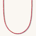 Close up of the Ruby Everyday tennis necklace on a white background