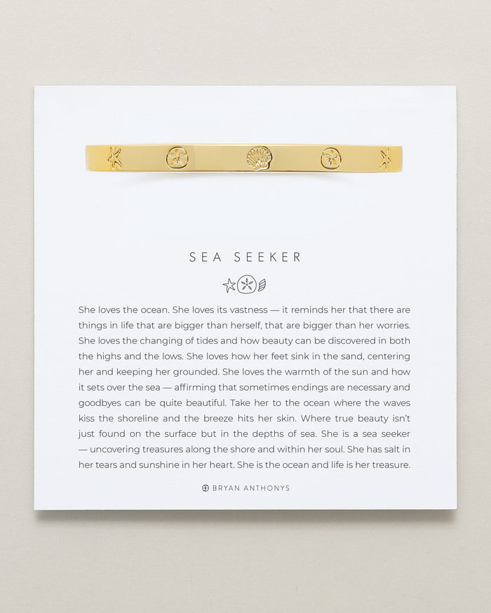 Bryan Anthonys Sea Seeker Gold Hinged Bracelet with sea shell engravings on card
