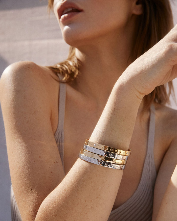 Bryan Anthonys Sea Seeker Gold Hinged Bracelet with sea shell engravings on card