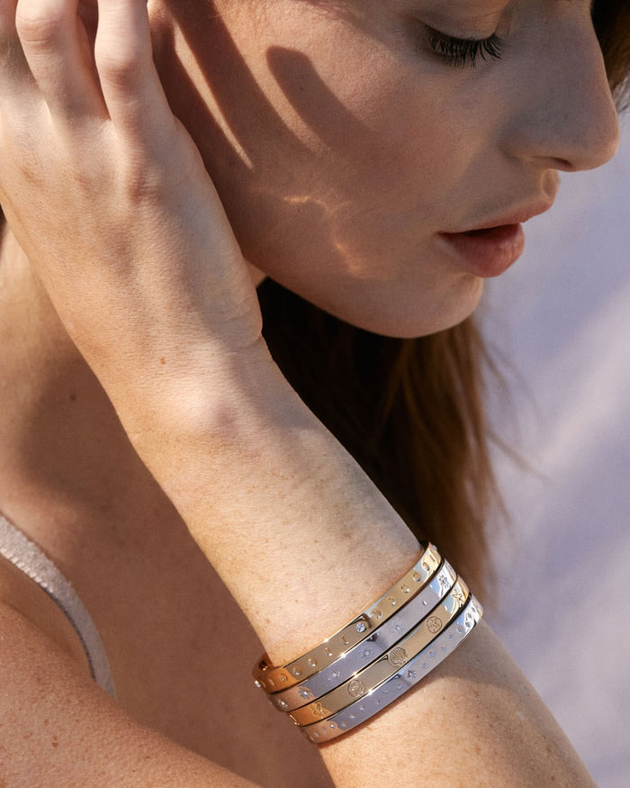 Bryan Anthonys Sea Seeker Gold Hinged Bracelet with sea shell engravings on card