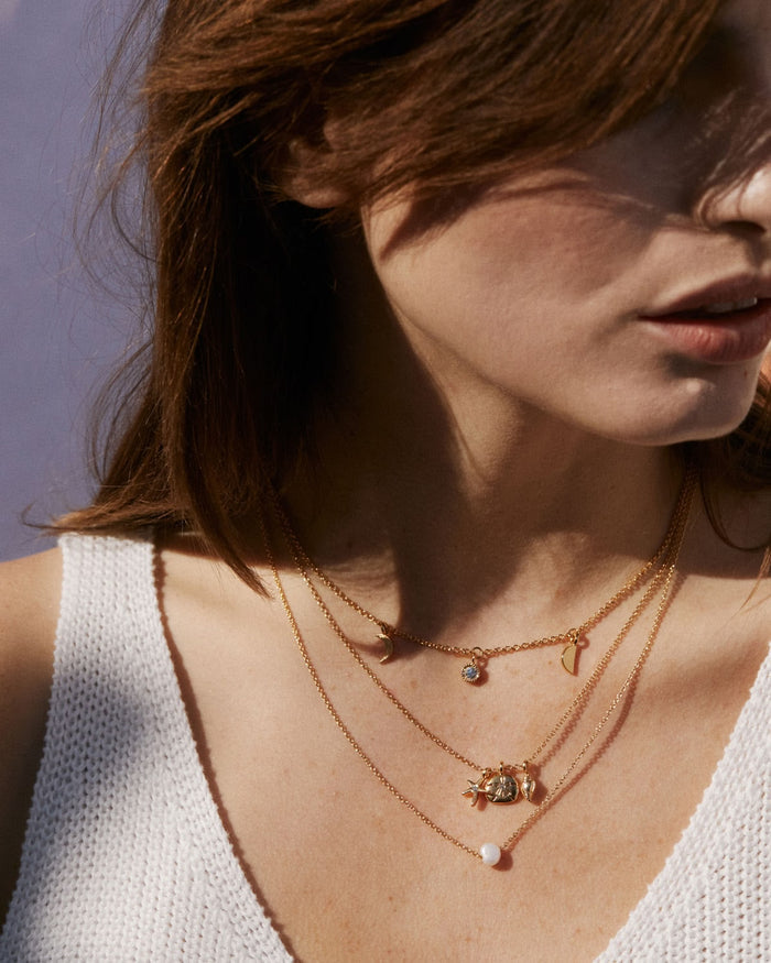 Bryan Anthonys Sea Seeker Gold Necklace with Crystal on model