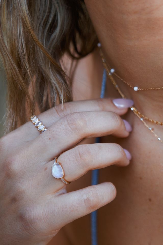 Detail of the pavé accent stones running along the She's a Gem ring band