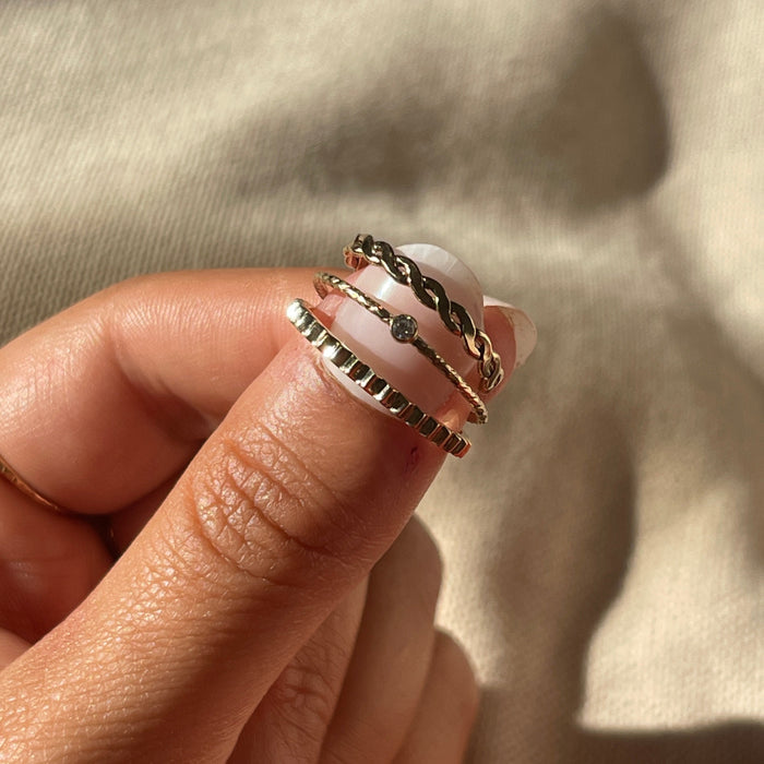The gold-filled Sierra ring with a twisted rope detail on a classic band