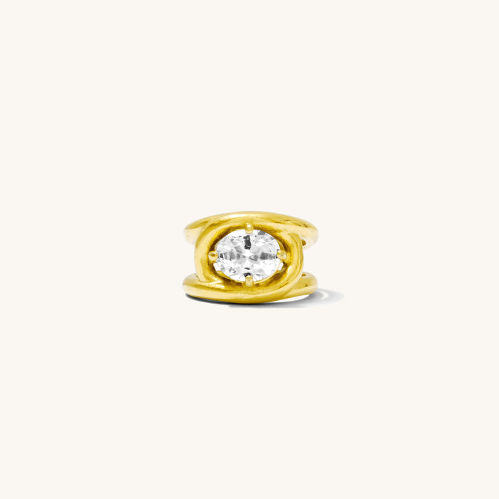 The gold Solitaire Love Knot ring, two bands twisting around a center stone