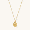 Gold St. Christopher pendant necklace on a dainty adjustable chain