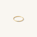 The Stardust ring with three petite stones set on a dainty gold band