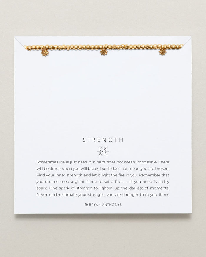 Close-up of Strength Beaded Icon Bracelet in 14k gold finish