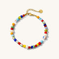 A colorful beaded gemstone bracelet with a gold-plated adjustable clasp, featuring multiple colors such as blue, red, yellow, and white.