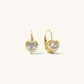 Heart-shaped gold earrings with clear gemstones on a white background