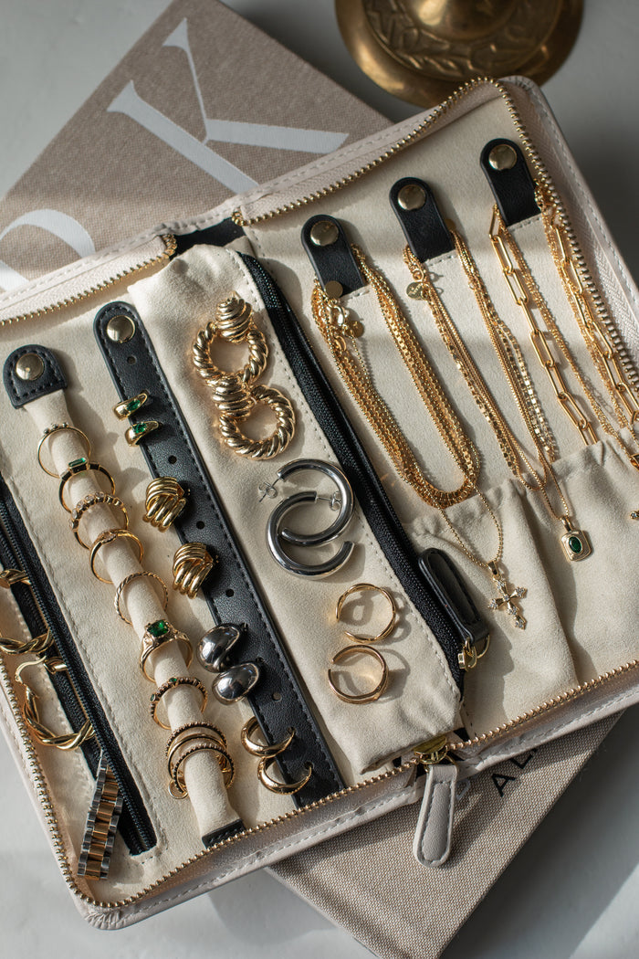 Compact travel jewelry case with a vegan suede interior for storing jewelry