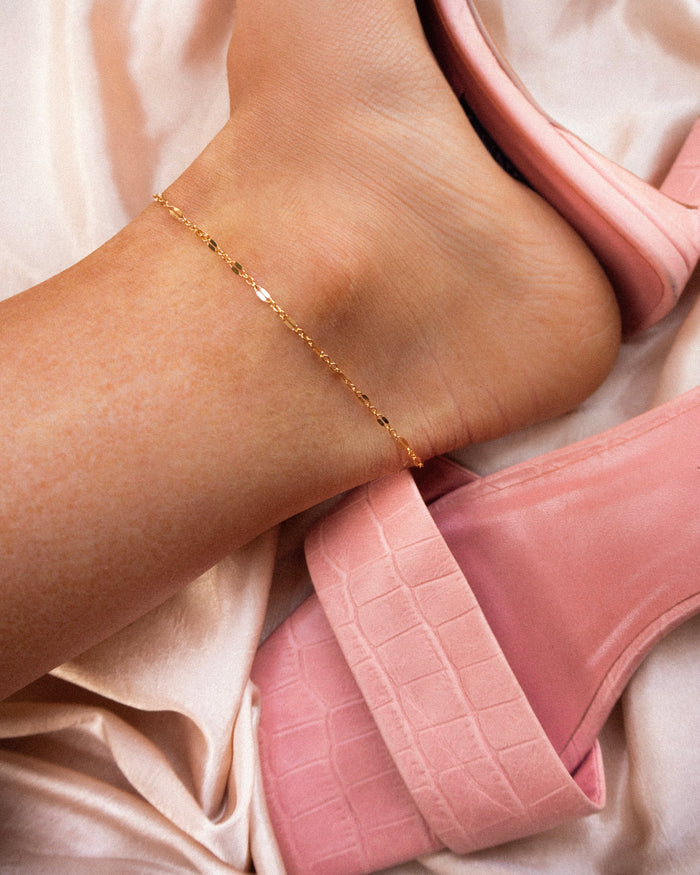 The Vica anklet, a delicate gold-filled chain with a one inch extender