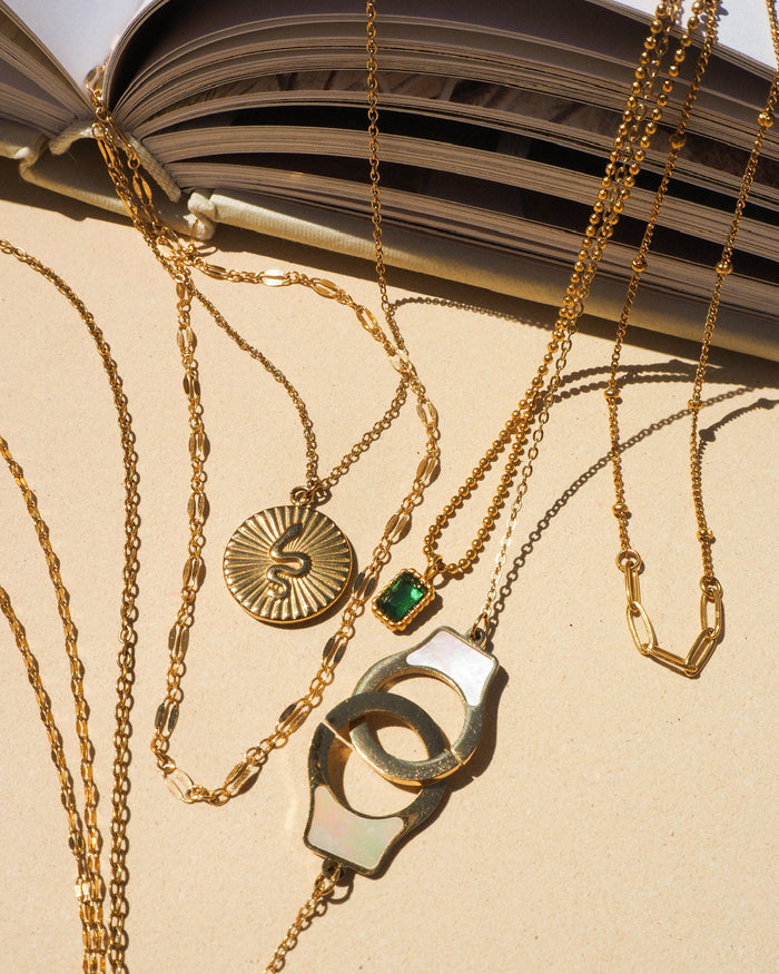 The gold Vica necklace, a fine shimmering chain for everyday layering
