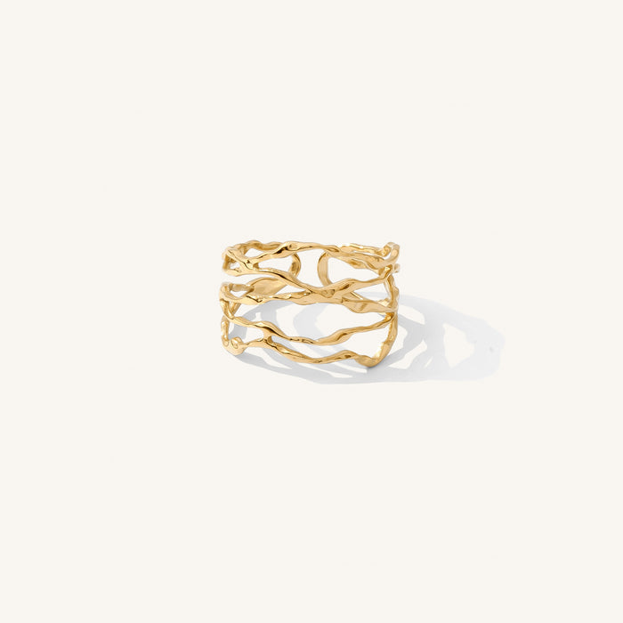 The Yule ring, a cuff-style band that mimics a stacked gold ring set